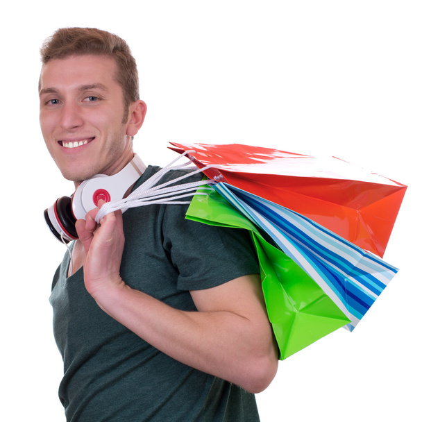 Casual man with headphones and shopping bags - Foto, Imagem