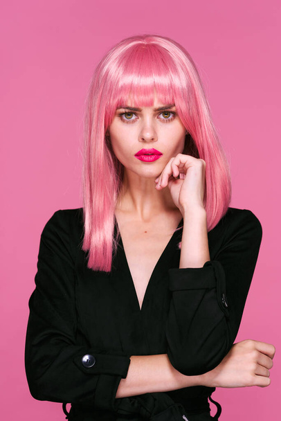 young beautiful woman in pink wig  posing in studio  - Foto, imagen
