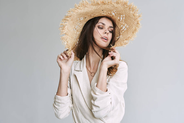 Portrait of young beautiful woman in straw hat. Fashion shot - Foto, Imagem