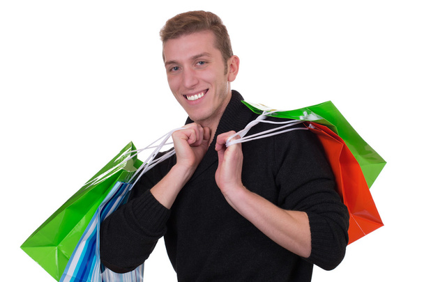 Smiling young man shopping or buying - Photo, Image