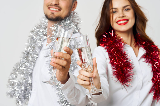 portrait of young beautiful couple celebrating New Year with champagne - Photo, Image