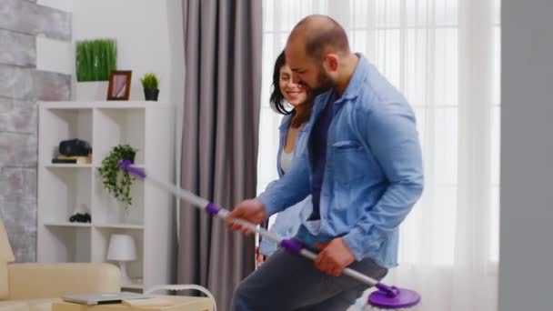 Husband dancing with mop - Footage, Video
