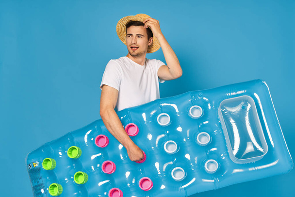 Young man with inflatable mattress - Photo, Image