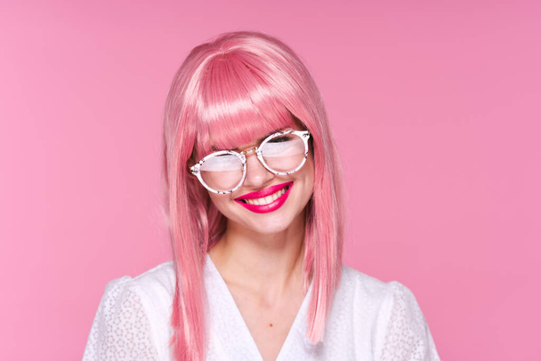 Young woman in pink wig smiling   on pink background - Photo, Image