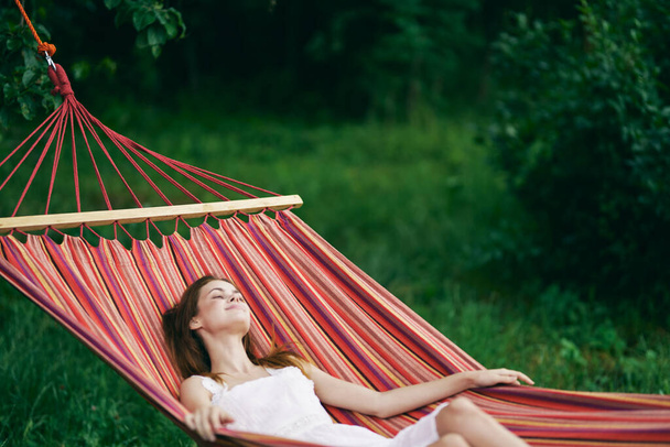 Young beautiful woman relaxing in hammock  - Zdjęcie, obraz