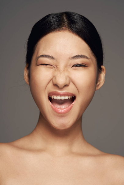 Portrait of young beautiful happy smiling asian woman    in studio - Zdjęcie, obraz