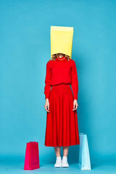    young beautiful woman with paper bag on head                              - 写真・画像