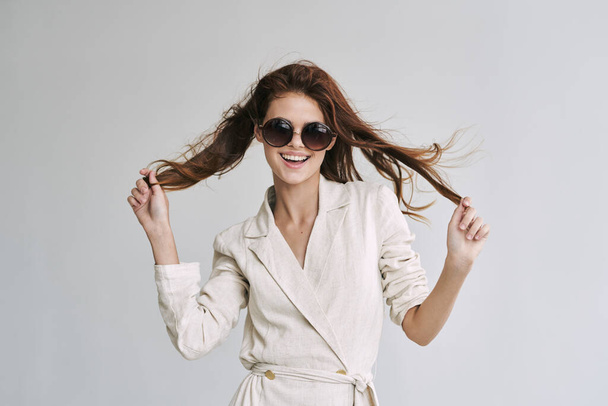 young beautiful woman in sunglasses  posing in studio   - Zdjęcie, obraz