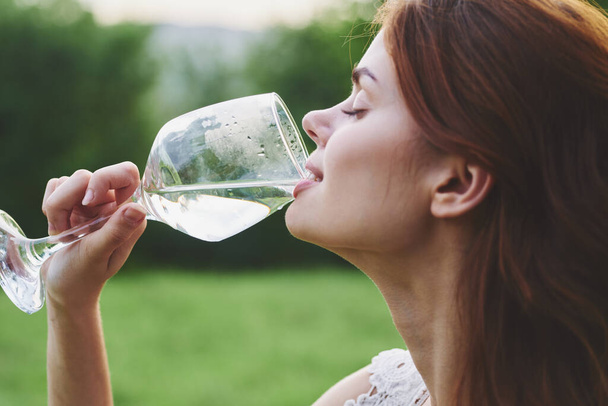 Young beautiful woman drinking wine  - Фото, зображення