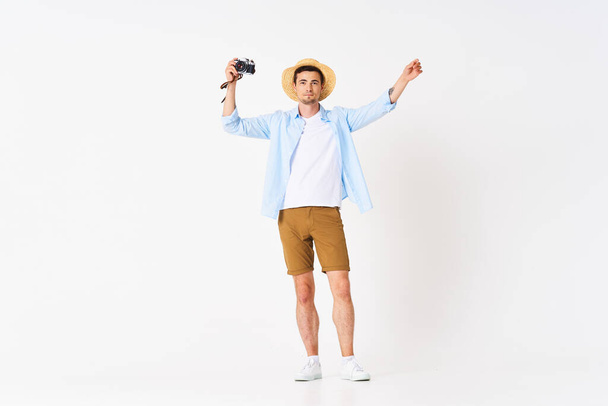 young  happy tourist with camera, studio shot - Foto, afbeelding