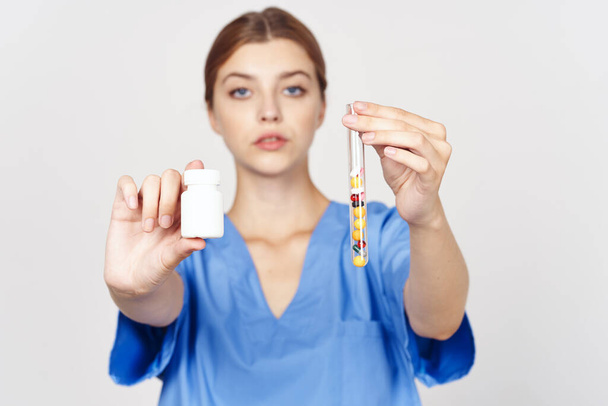 Young doctor with pills in studio - Photo, Image