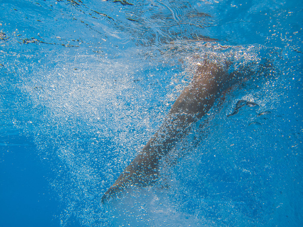 Young woman legs undewater in the pool - Φωτογραφία, εικόνα