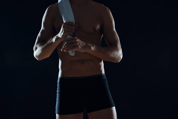 Studio shot. male bodybuilder, nude athlete with towel - Fotografie, Obrázek
