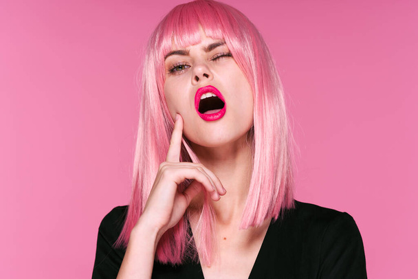 Young woman in pink wig winking   on pink background - Photo, Image