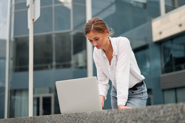 Businesswoman successful woman business person outdoor corporate building exterior with laptop Pensive elegance cute caucasian professional business woman middle age ecommerce deal Online banking - Fotografie, Obrázek