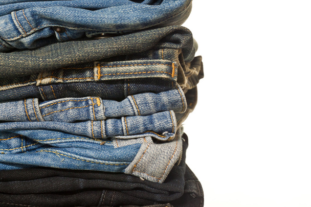 Stack of jeans on white background. - Photo, Image
