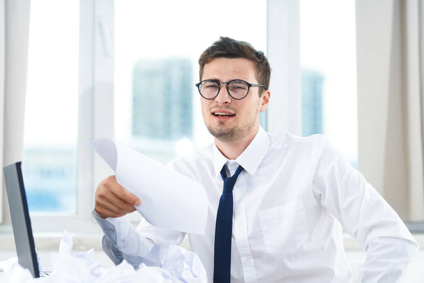  businessman with papers   in the office  - Photo, Image