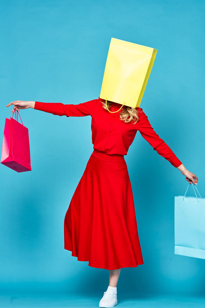    young beautiful woman with paper bag on head                              - Фото, изображение
