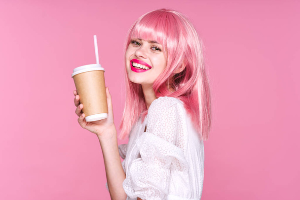 young beautiful woman in pink wig  posing with coffee cup - Foto, Imagem