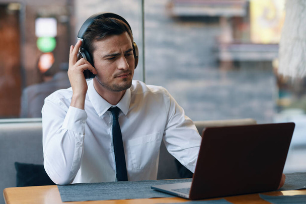 young handsome businessman with headphones on  - Photo, Image