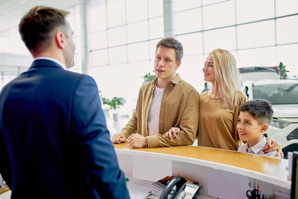 I am glad to see you here. pleasant staff of dealership talk to customers - Photo, Image