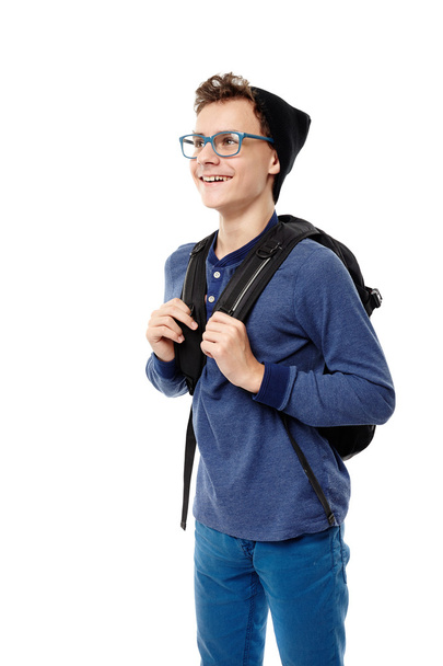 Trendy teenager with backpack wearing cap and glasses - Foto, Imagen