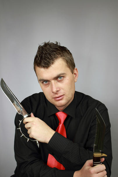Бизнесмен с ножом
 - Фото, изображение