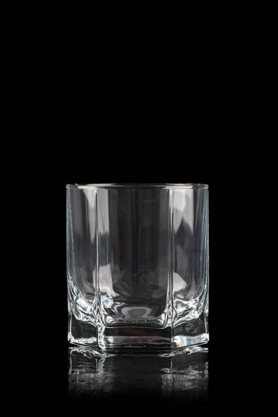 Empty glass for alcoholic drinks on black background - Foto, immagini