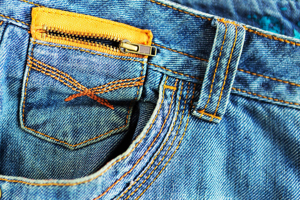 Джинсы из синей джинсы, крупным планом. Фон моды. Джинсовая текстура
 - Фото, изображение