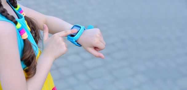 Girl using smart watcht.Safety concept.Copy space for text. Banner - Zdjęcie, obraz