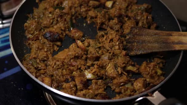 South Indian dish spicy beef fry Kerala, India. side dish ghee rice, appam, parotta, puttu, bread and chappathi, Kerala cuisine ,Buffalo roast / Meat pepper fry with coconut. India spices cooking, - Footage, Video