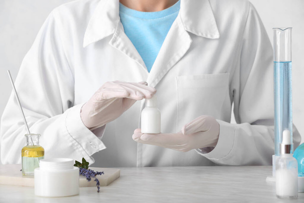 Beautician preparing natural cosmetic in laboratory, closeup - Zdjęcie, obraz