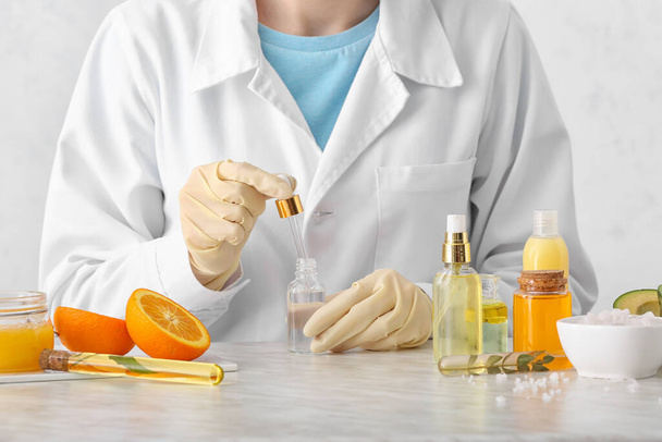Beautician preparing natural cosmetic in laboratory, closeup - Photo, Image