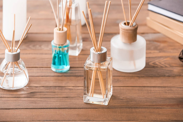 Reed diffusers on table in room - Photo, Image