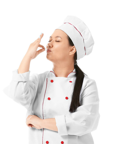 Kaunis aasialainen kokki valkoisella taustalla
 - Valokuva, kuva