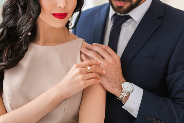 Young couple wearing stylish accessories indoors - Foto, Imagen
