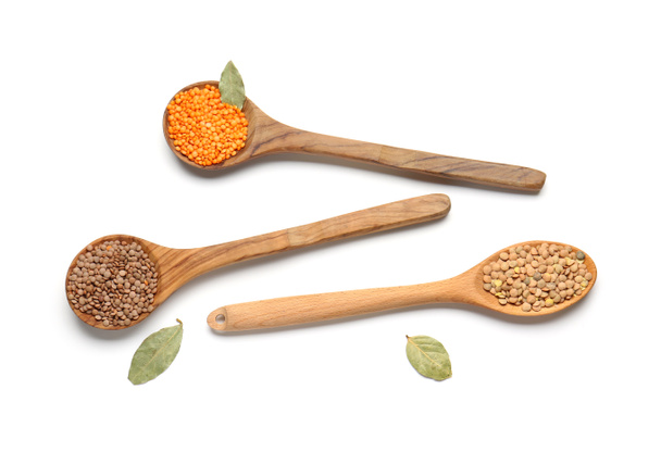 Spoons with lentils on white background - Photo, Image