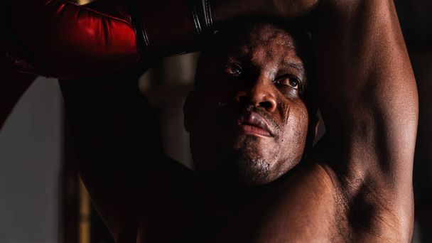 close up portrait of african american boxer face with serious eyes looking - Photo, image