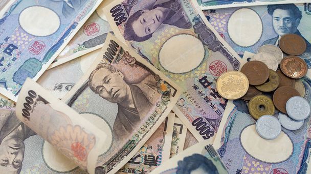 Ιαπωνικά χαρτονομίσματα γιεν και ιαπωνικά κέρματα γιεν για χρήματα. - Φωτογραφία, εικόνα