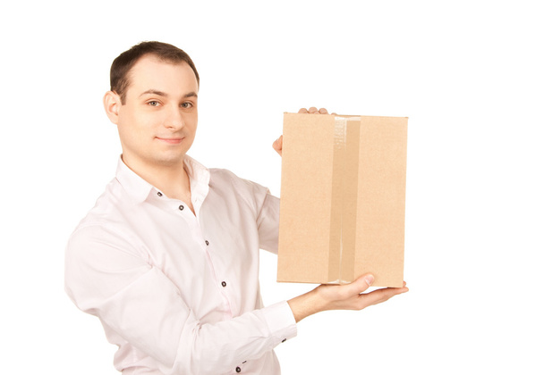 Businessman with parcel - Фото, изображение