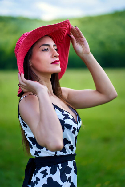 Gorgeous beauty model in summer dress posing outdoor in an oak forest - Photo, Image
