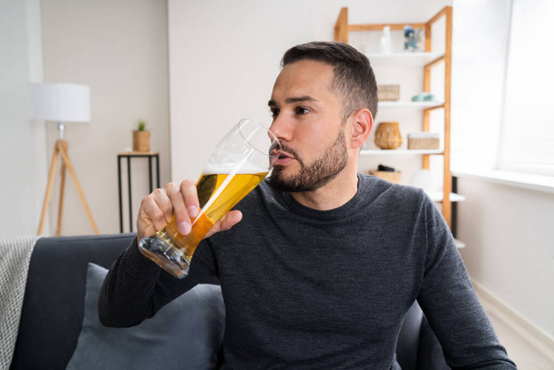 Man Drinking Beverage Beer Alone At Home - Photo, image