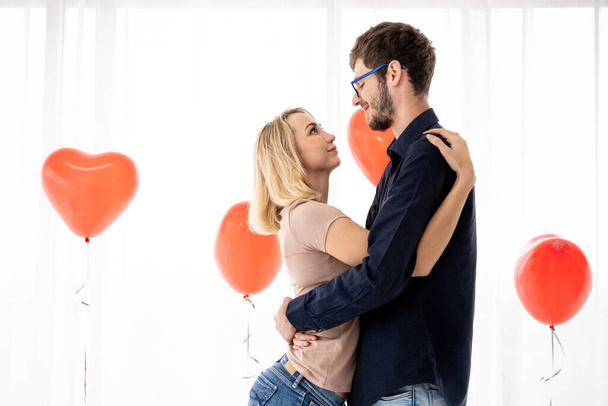 Young caucasian couple portrait in romantic moment together. Romantic couple in Valentine's day concept. - Valokuva, kuva