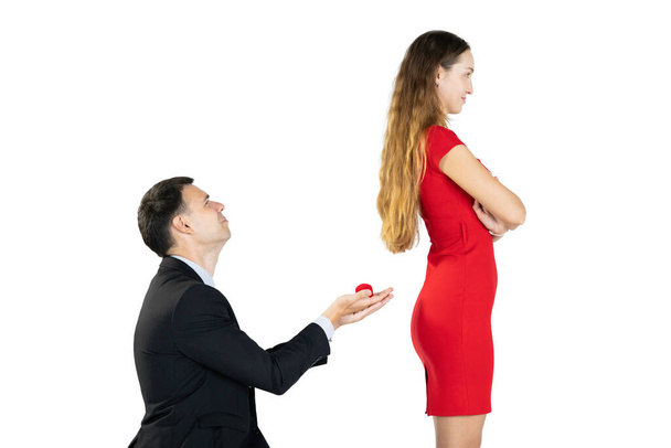 Isolated with clipping path. Man asking his girlfriend to marriage. - 写真・画像