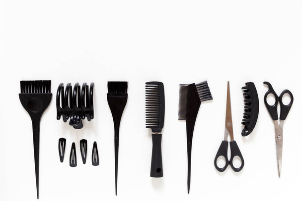 hairdresser equipment placed down on flat lay with copy space. - Фото, изображение