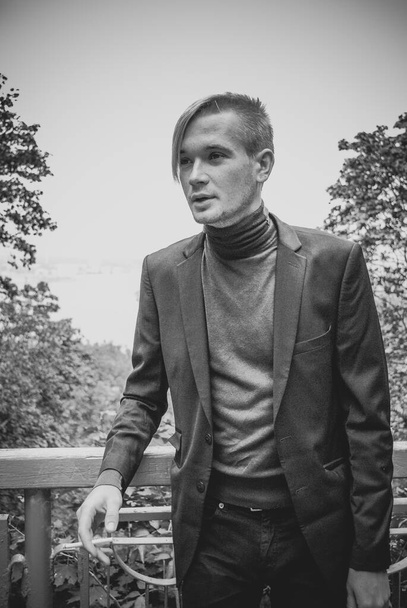 Young guy walking around and smoking, Student at city street, college or university lifestyle time - Valokuva, kuva