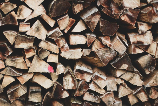 A closeup of a pile of wooden sticks placed on each other - Fotó, kép