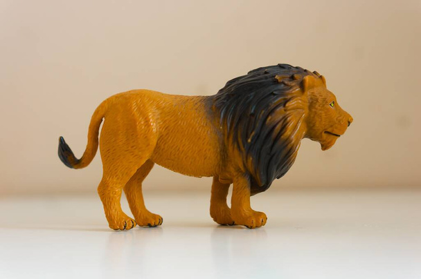 A closeup shot of the toy of a lion on a white background - Foto, immagini