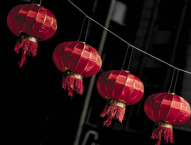 A closeup shot of carnival red decoration on dark background - Fotografie, Obrázek