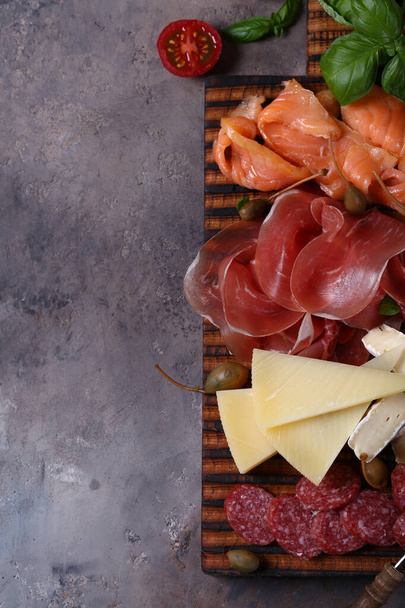 assorted ham, salmon and salami sausage - antipasti appetizer - 写真・画像